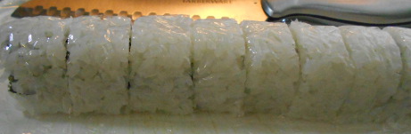 cutting a sushi roll